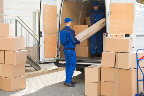Mover loading boxes safely into a van in Cranham