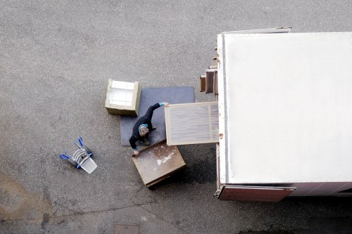 Professional movers loading furniture for a local removal job