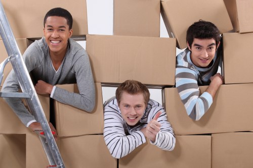 Packed household boxes and furniture prepared for transport in Cranham