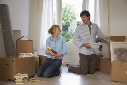 Packed boxes and furniture ready for collection on moving day